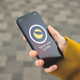 A person holds a phone with the Terra symbol and the words Terra Luna